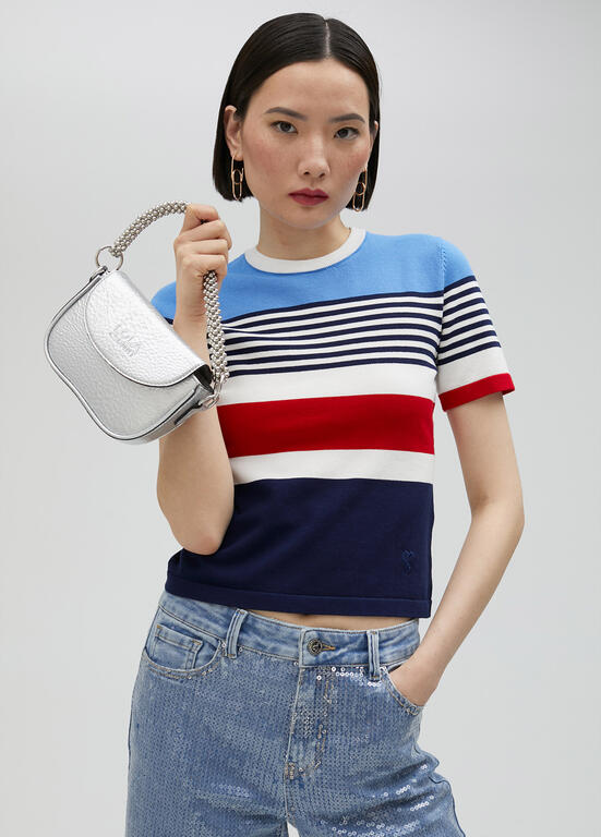 Bandolera Lola Casademunt efecto piel metalizada con asa metálica decorativa plateado