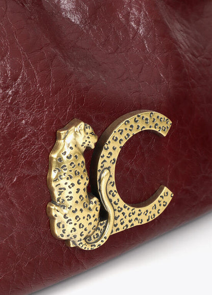 Bolso Lola Casademunt Bandolera pequeña con detalle de asa trenzada BURDEOS