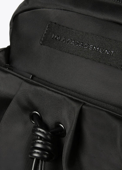 Mochila Lola Casademunt negra de nylon con detalles en efecto piel y tiradores flúor
